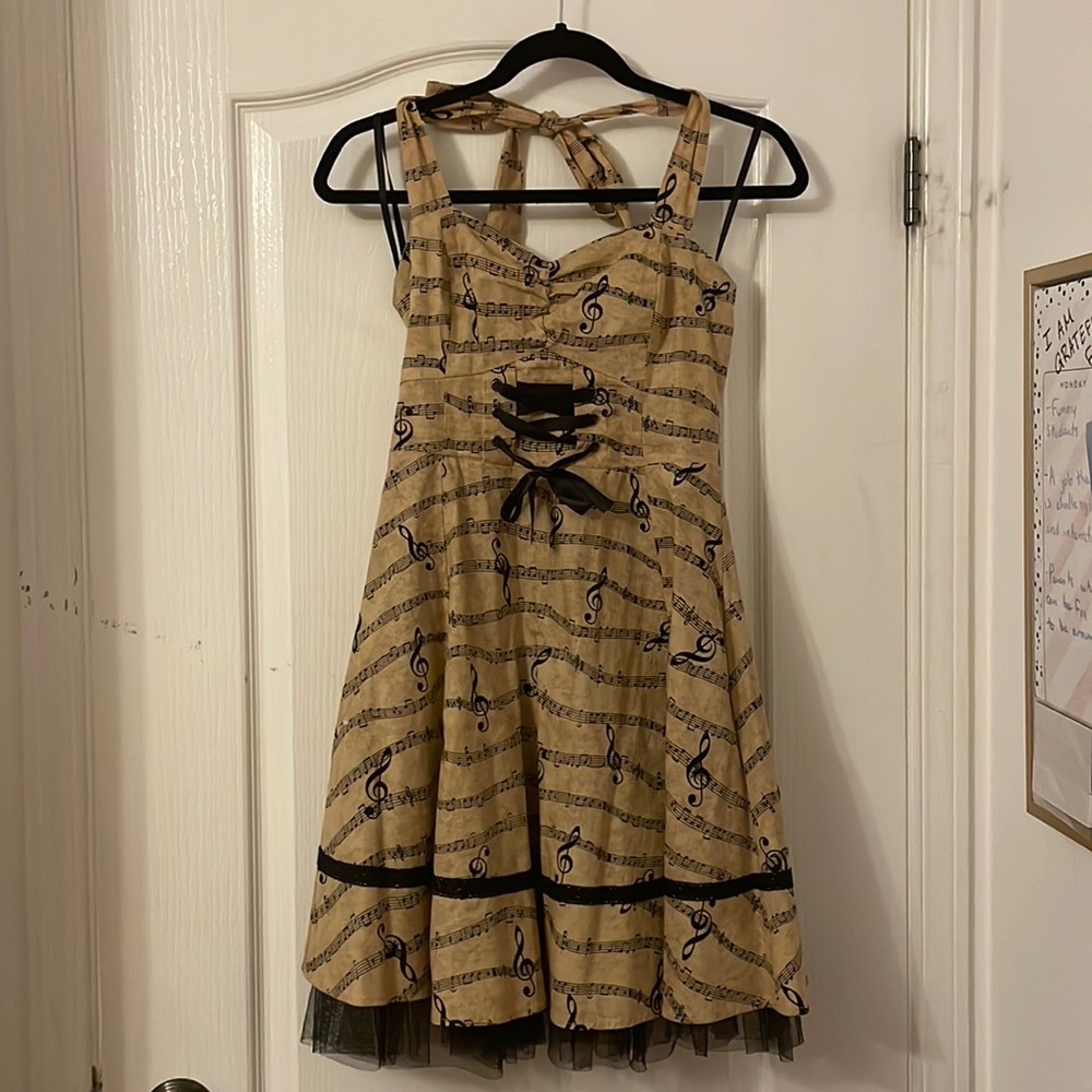 Hot topic, SM (small/medium) brown music note dress with black crinoline.